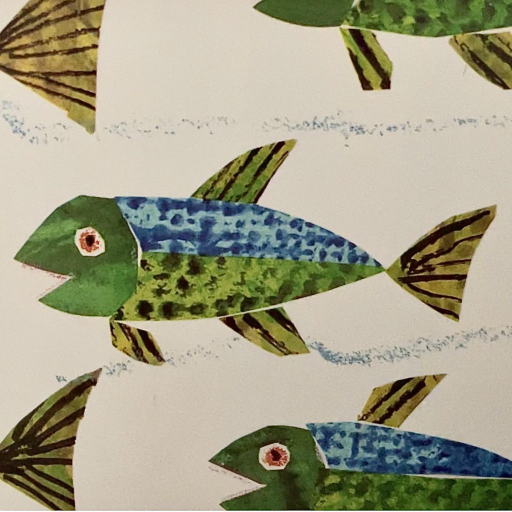 An Eric Carle cut paper fish illustration in green, with a blue back. From the book Rooster's Off to See the World.