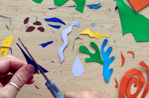 Hand cutting Matisse-inspired shapes from colored card stock.